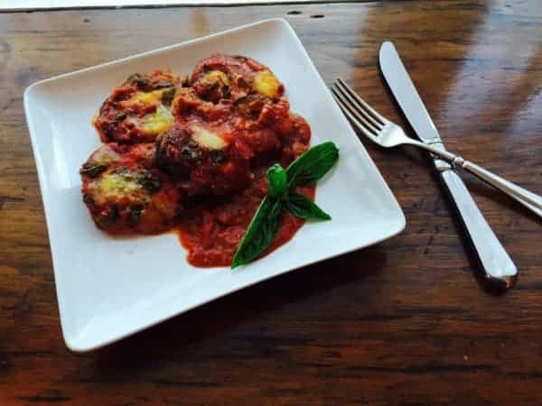 The eggplant in Eggplant Parmesan can be sliced in rounds or long strips.