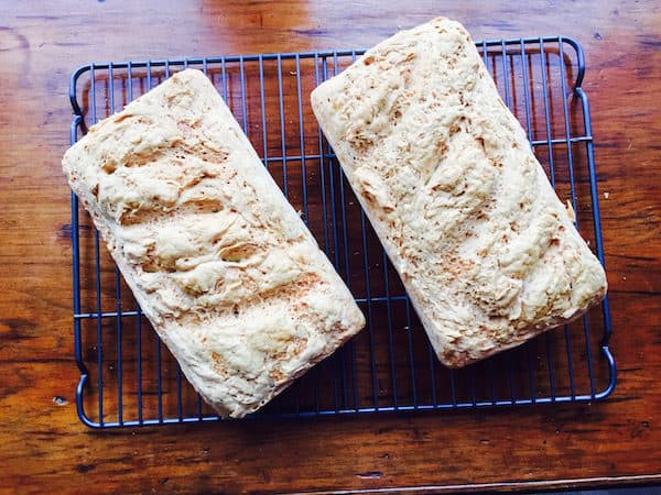 Two loaves of Gluten Free White Bread cooling.