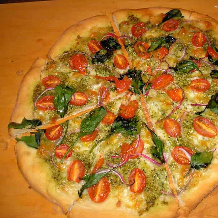 Pizza with Homemade Dough, Grape Tomatoes and Spinach.