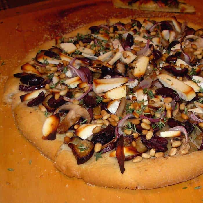 Homemade Pizza with Eggplant and Pine Nuts.