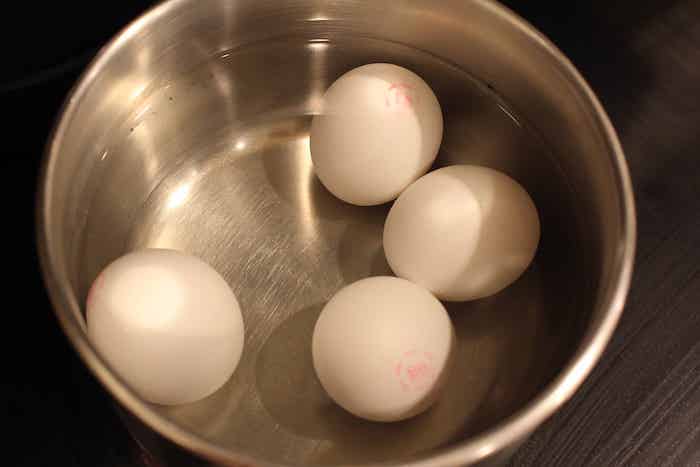 Step 1: Gently put the eggs in a pot and cover them with water.