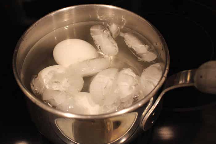 Step 4: Carefully pour off the hot water. Add cold water and ice and let the eggs cool for a few minutes.