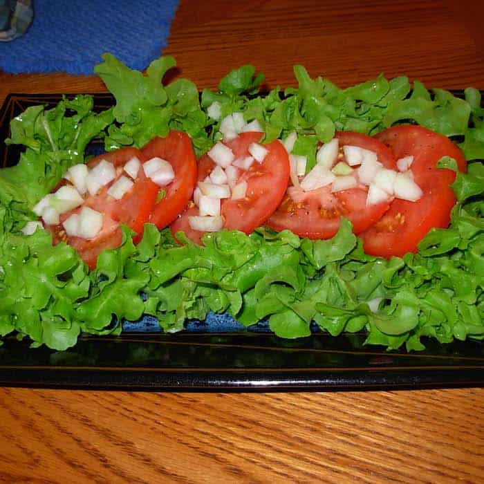 Bitter leaf lettuce, tomato and onions is a good combination for Vinegar Dressing