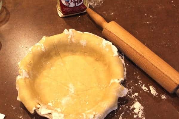 Ready to crimp the edges. For an unbaked pie like Lemon Meringue, prick the crust a few times before baking. Add pie weights or beans to maintain shape. For Pumpkin Pie, however, you just fill it and bake it with the filling. (No pricking.)