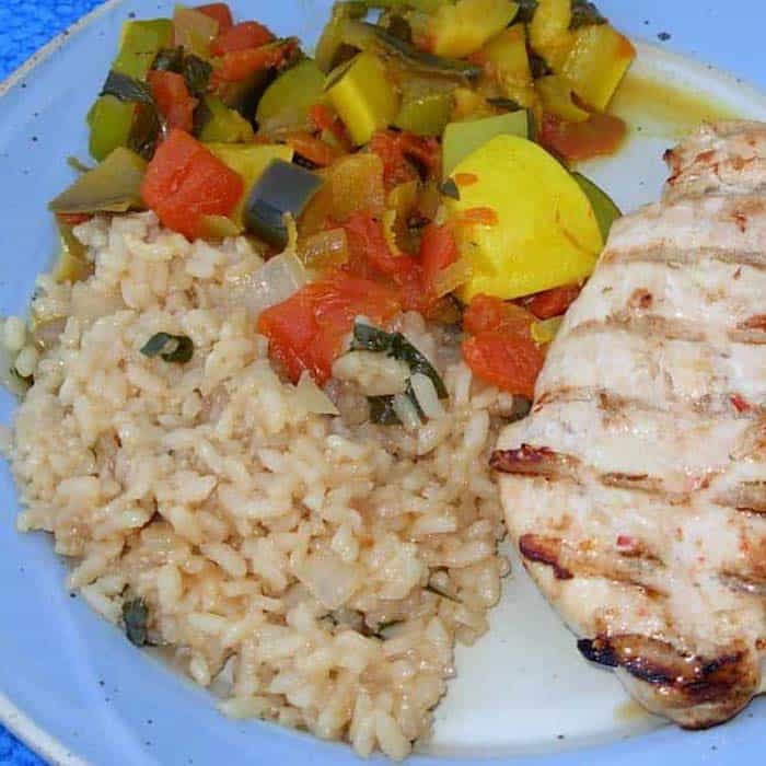 This recipe tells you how to make risotto, shown here with Italian Chicken and Indian Ratatouille.
