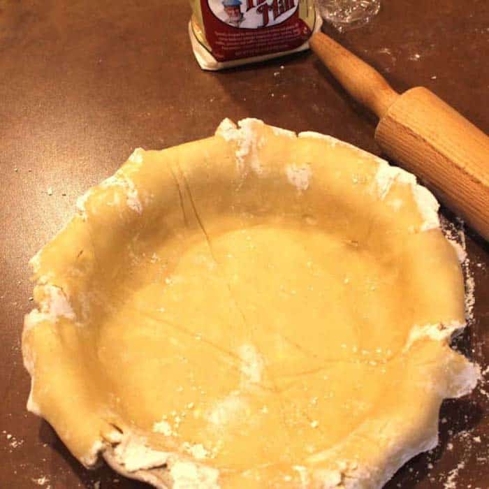 Flakly Pastry Crust, ready to crimp the edges. For an unbaked pie like Lemon Meringue, prick the crust a few times before baking. Add pie weights or beans to maintain shape. For Pumpkin Pie, however, you just fill it and bake it with the filling. (No pricking.)