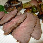 London Broil Steak satisfies the need for beef. Shown with a grilled mushroom and Brussels sprouts.