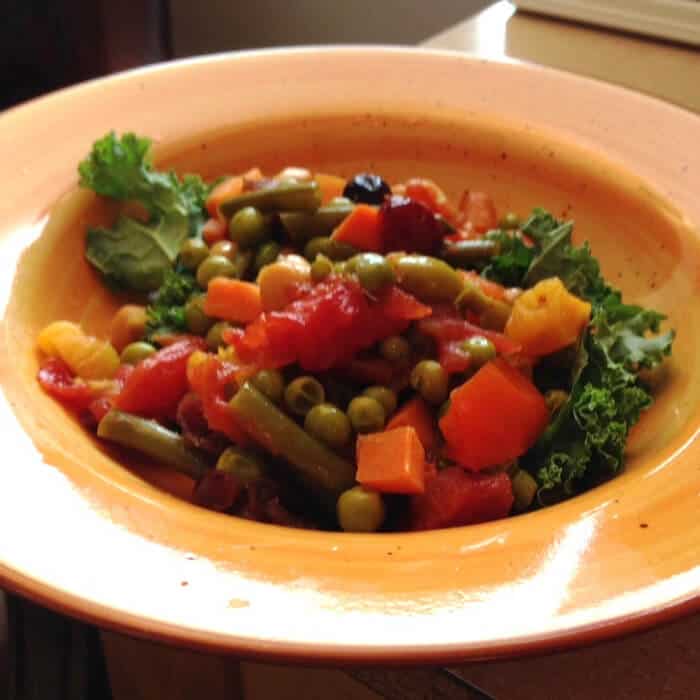 Moroccan Chickpea Stew served over raw kale.