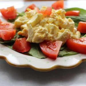 Egg Salad is tasty alone, over greens, on a sandwich or stuffed in a tomato.
