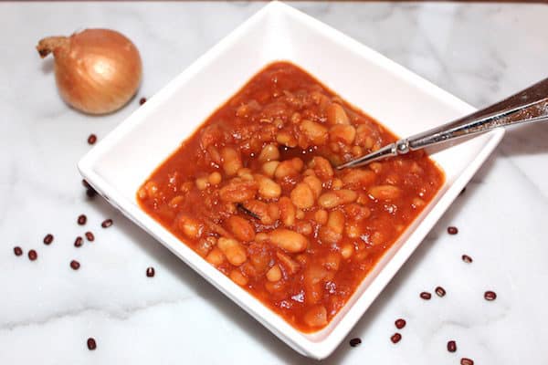 Crockpot Maple Baked Beans. Just sauté the onion and dump everything in the slow cooker on low for 4-6 hours.