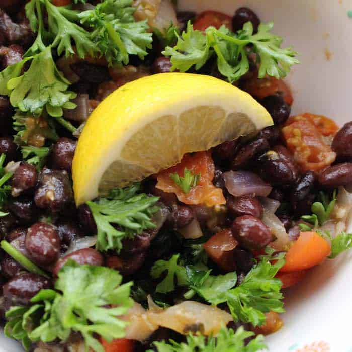 Middle Eastern Black Bean Ful, only the most flavorful bean dish you can eat. Top it with Tomato Basil Chutney for an even more delicious meal.