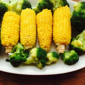Fresh boiled corn and steamed broccoli make a scrumptious meal.