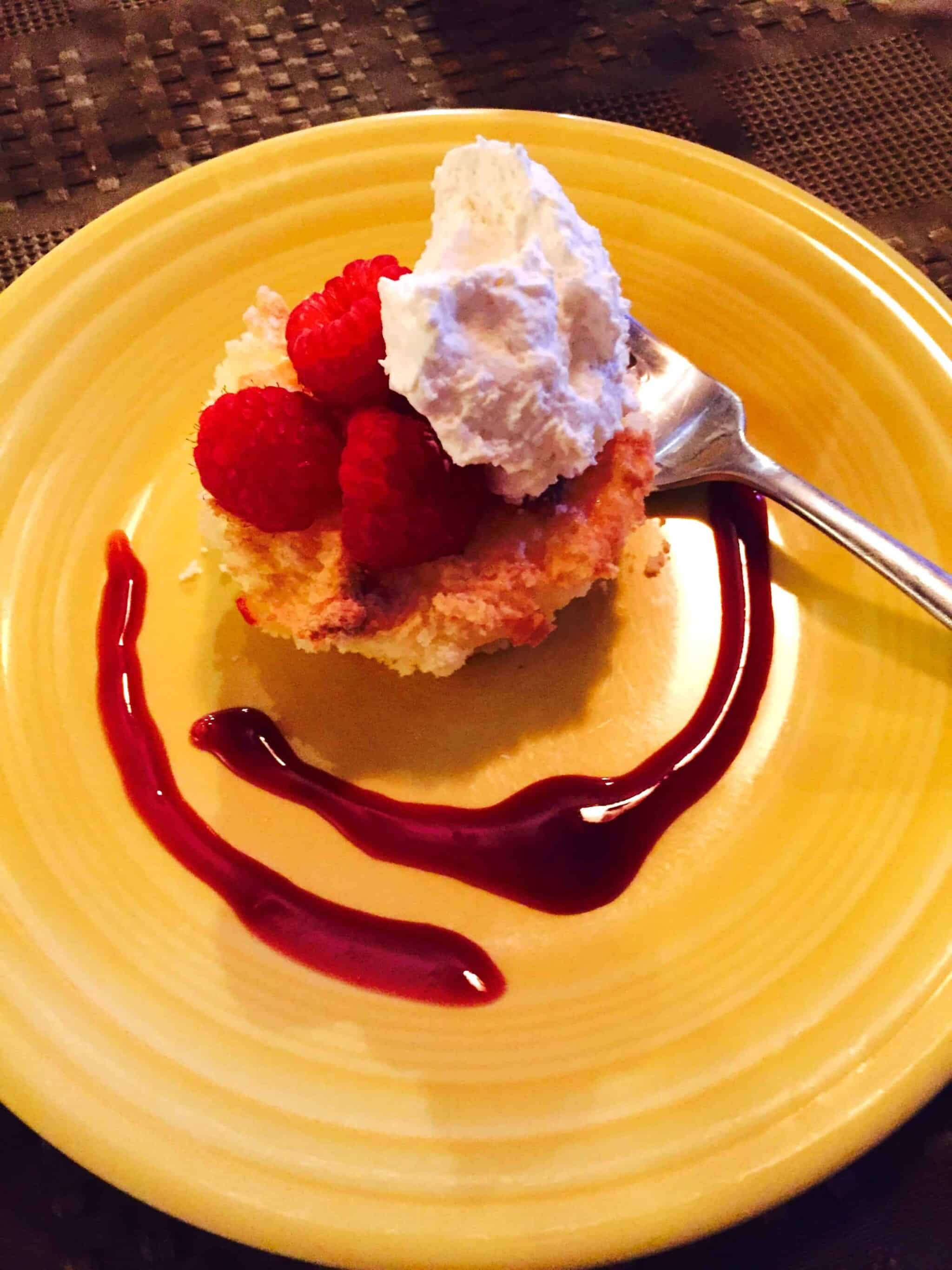 Light, airy Gluten Free Lemon Cake with Raspberries and Whipped Cream