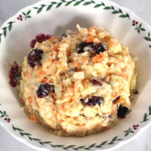 Craisin Coleslaw can be made with dried cranberries (craisins) or raisins.