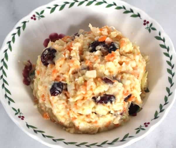 Craisin Coleslaw can be made with dried cranberries (craisins) or raisins.