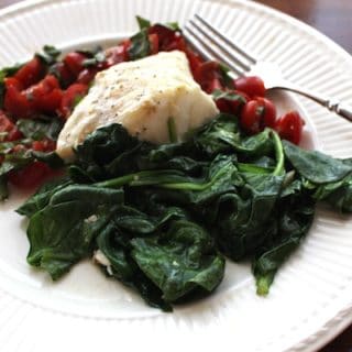 Sautéed Spinach shown with Cod and Tomato Basil Chutney