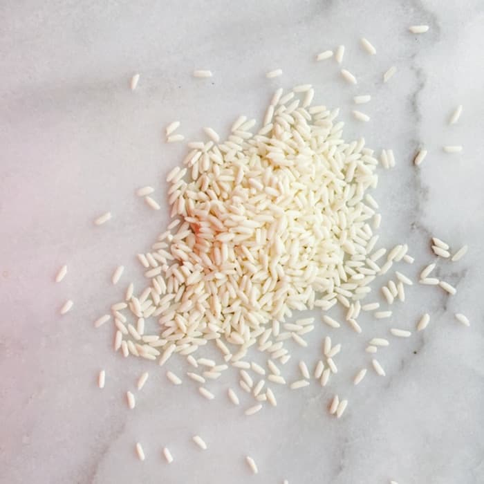 Sticky Rice has a dull white coating and is a little bigger than long grain white rice.