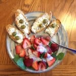 Simple Strawberry Spinach Salad Recipe with Brianna's Poppyseed Dressing, shown with Gluten Free Dairy Free White Bread, goat cheese and olives. Add a glass of wine for a lovely lunch. #strawberryspinachsalad #simplestrawberryspinachsalad #sitdownandrelax