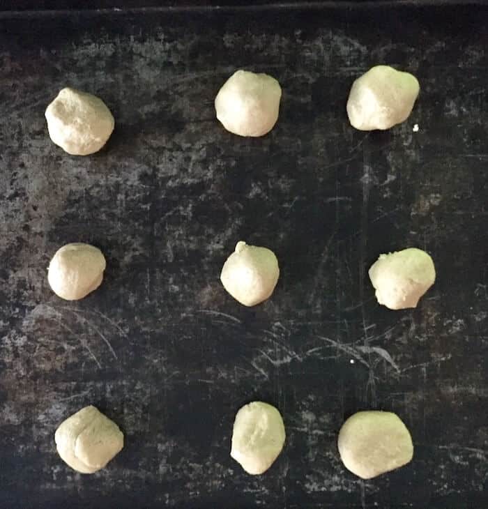 Roll into 1" balls, 15 to a cookie sheet.