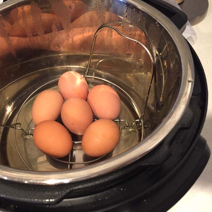 See the metal insert? That keeps the eggs from rolling around and breaking during the cooking process.