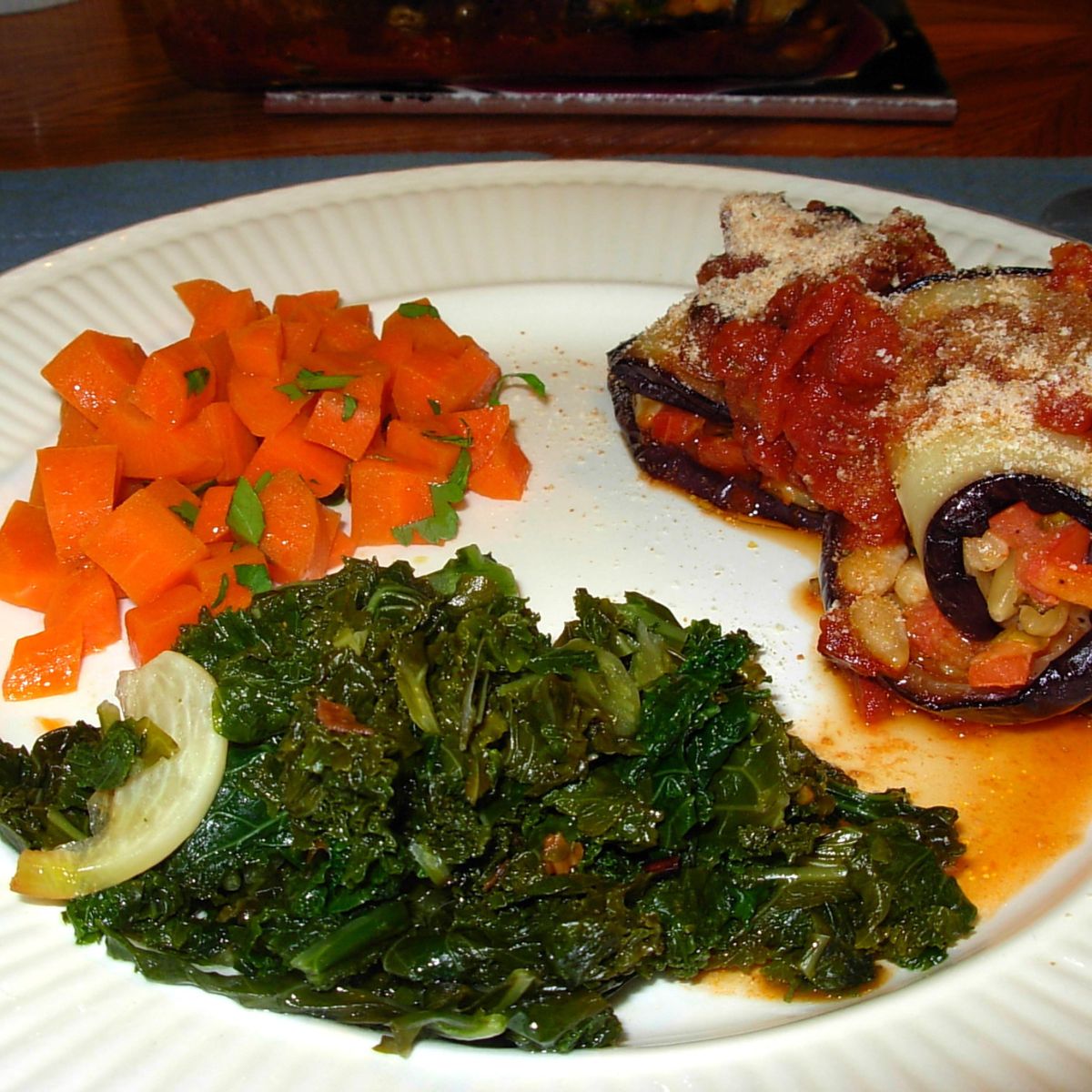 bitter greens with carrots and minty eggplant rolls