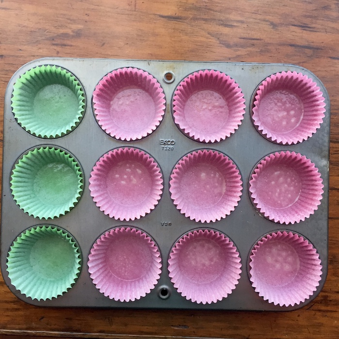 Cupcake pan with oil-sprayed liners.