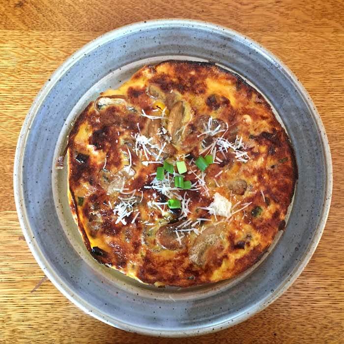 A frittata (in this case Mushroom and Yellow Pepper) is delightful for breakfast or supper, especially when served on a beautiful hand-made plate by Quail Run Pottery.