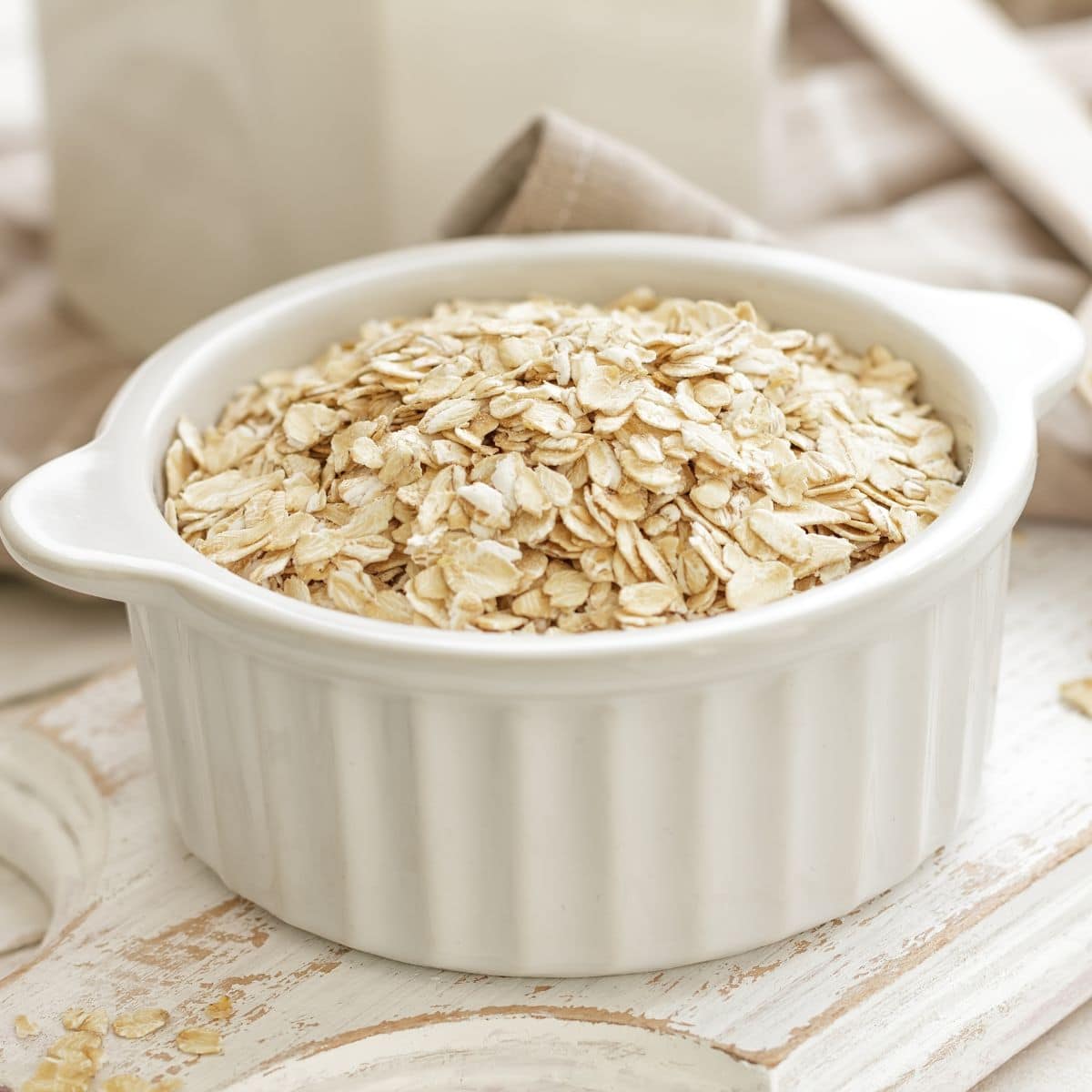 uncooked oatmeal in a white bowl