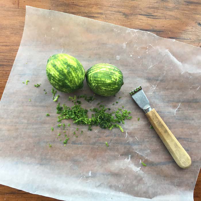 Zest the limes. Reserve about half a teaspoon of zest to use as garnish. Put the rest of the zest into the blender. Blend the mixture until smooth.