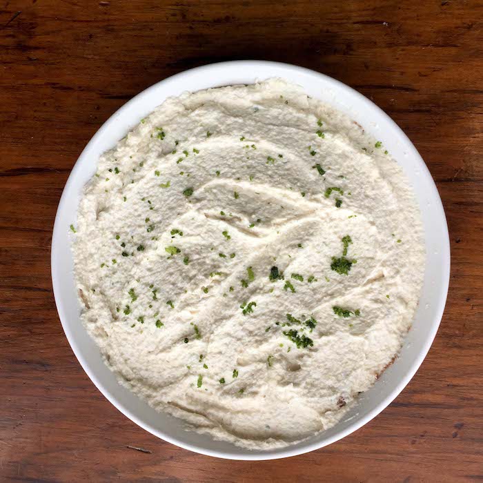 Fill the pie crust with the Key Lime Pie filling. Garnish with lime zest.