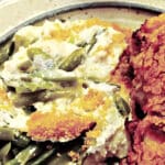 fancy green bean casserole with Swiss cheese, sour cream, and cornflake crums