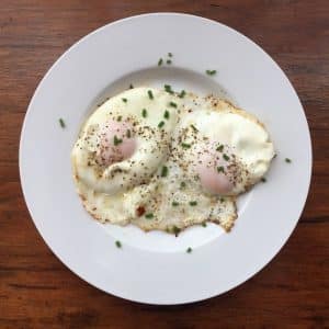 basted eggs on a white plate