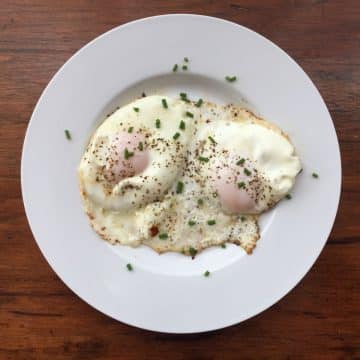 basted eggs on a white plate