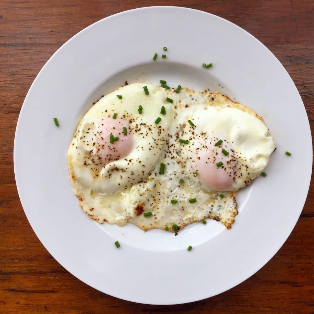 basted eggs on a white plate