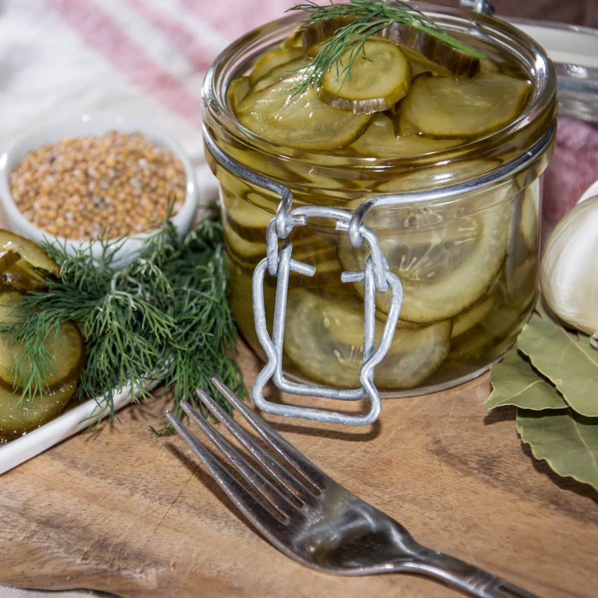 a glass jar with pickles