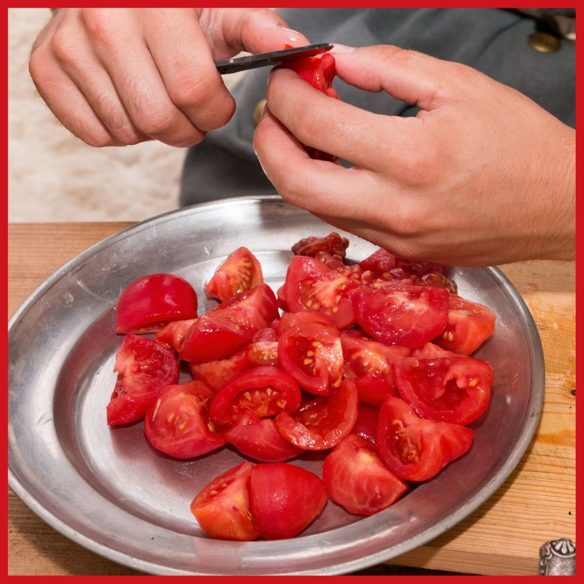 hands peeling tomatoes