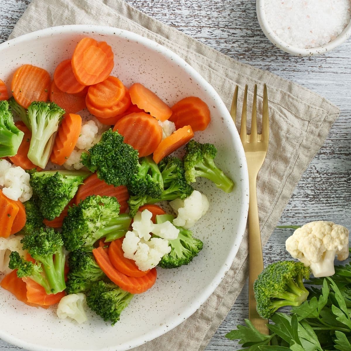 steamed veggies on a white plate