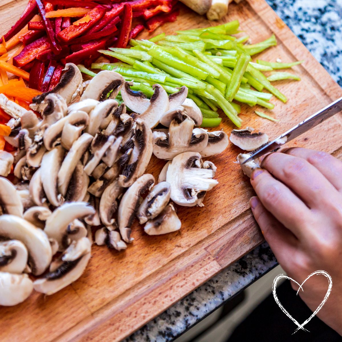 chopped vegetables on a wooden cutting board