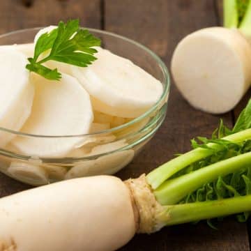 sliced daikon radish in a glass bowl