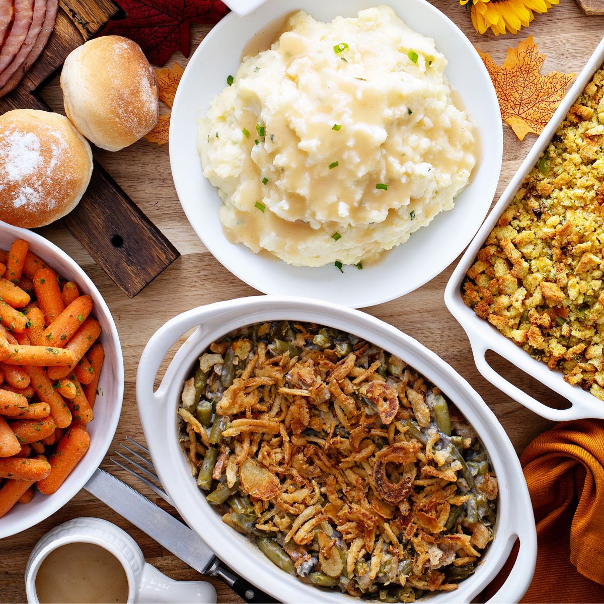 Vegan thanksgiving meal: mashed potatoes, cooked carrots, and green bean casserole