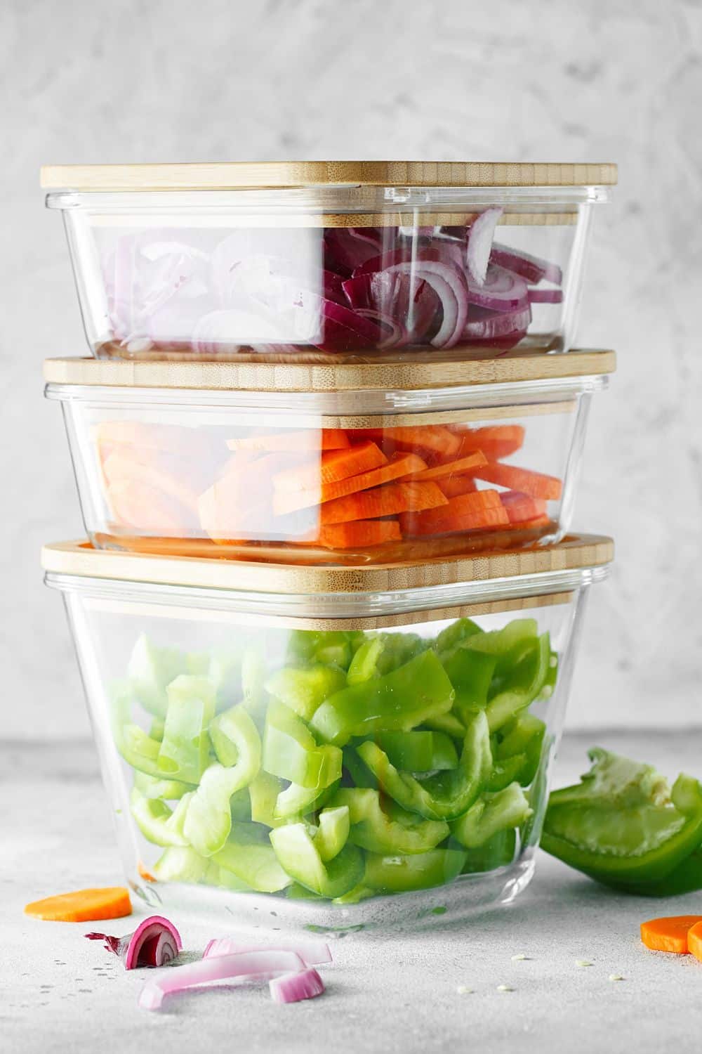 chopped veggies in glass containers, ready for salad