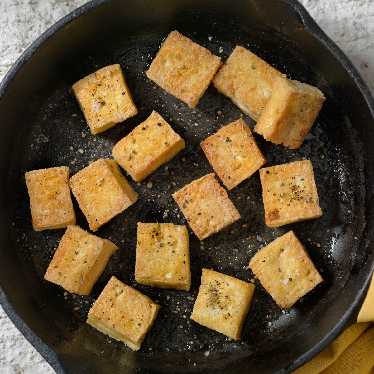 tofu frying in pan without oil