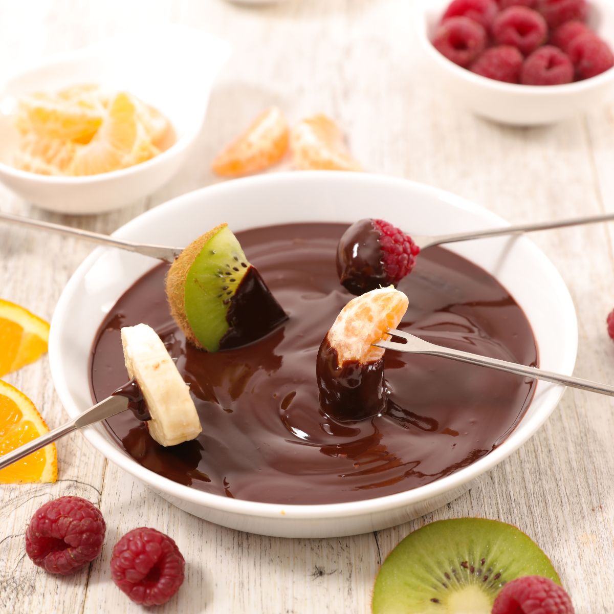 a bowl of choclate sauce for dipping fruit