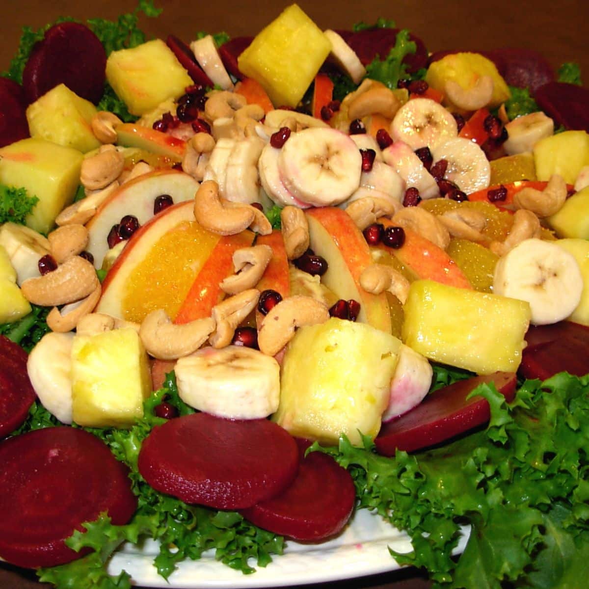 Christmas eve salad with fruits, vegetables and nuts