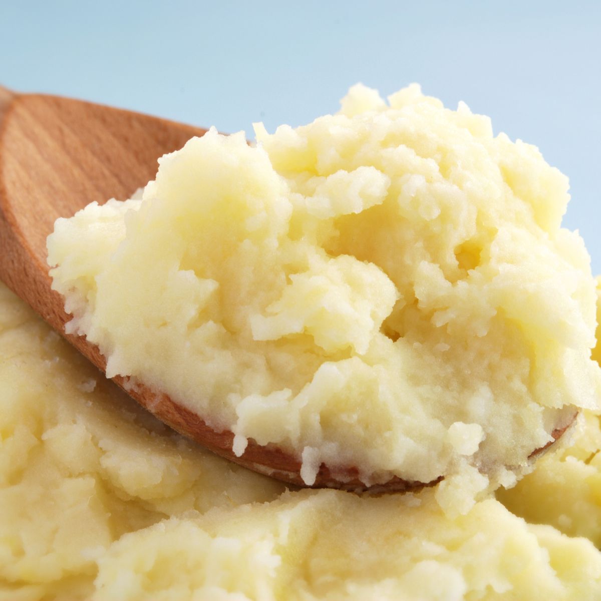 wooden spoon with mashed potatoes
