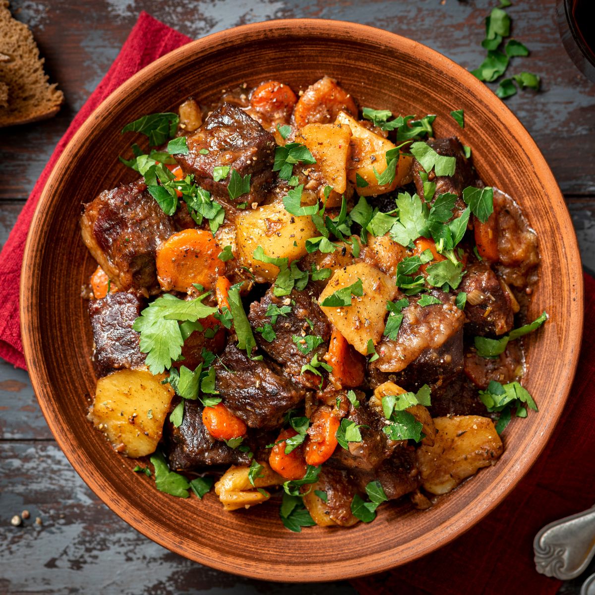 a bowl with meat and root veggies.