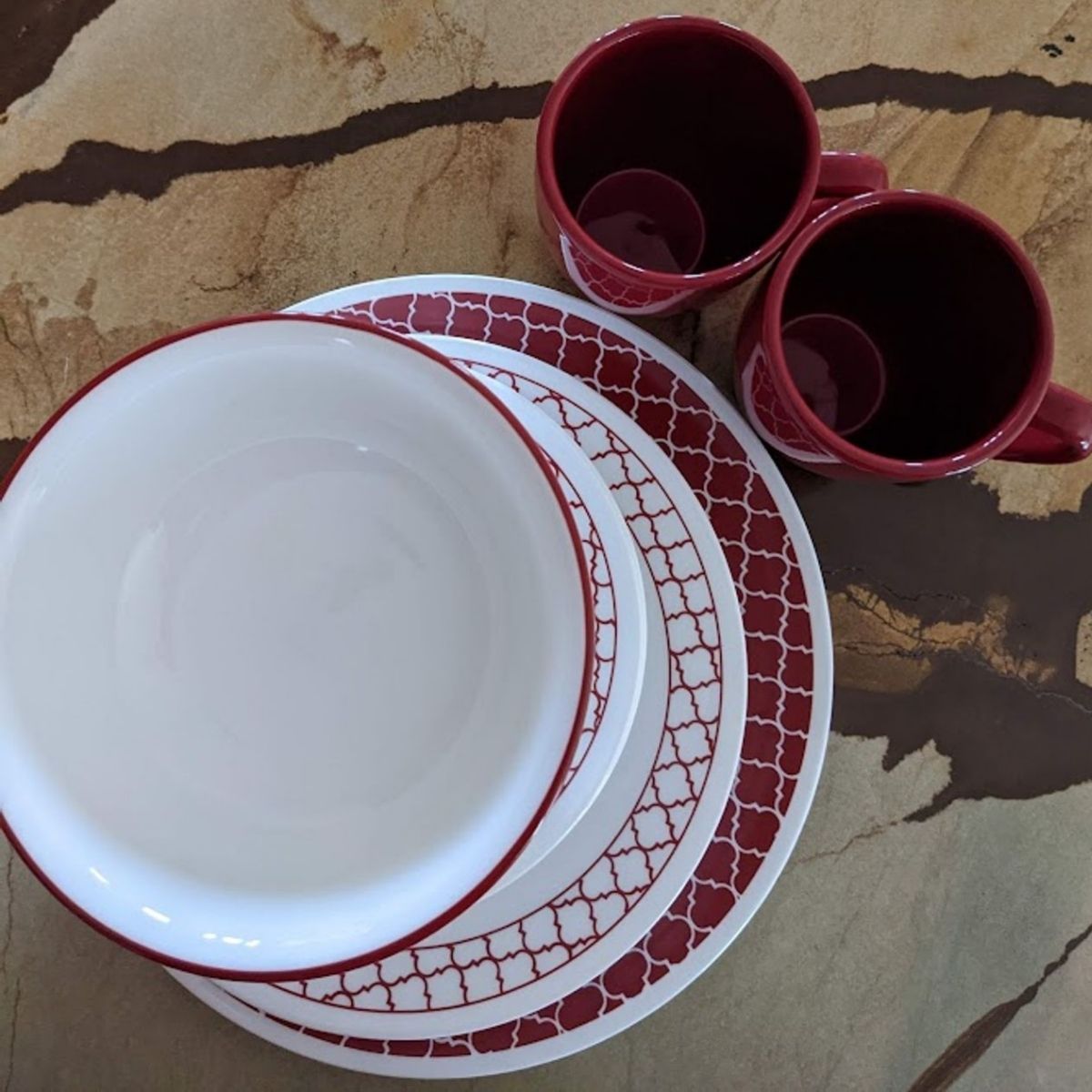Corelle dish set with a red on white design, called Crimson Trellis.