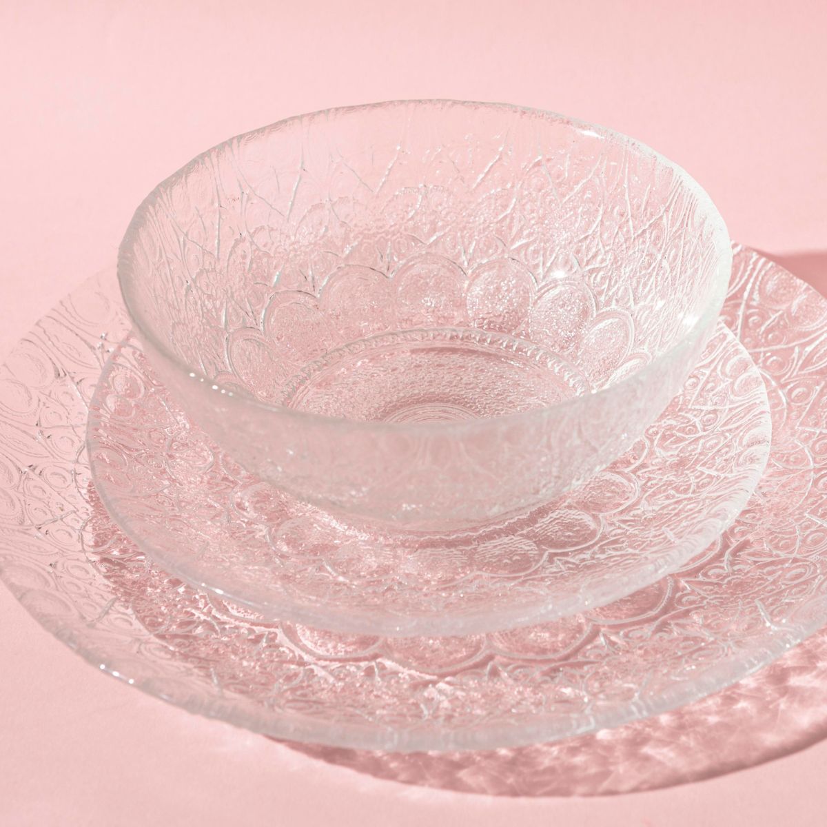 glass dish set sitting on a pink tablecloth