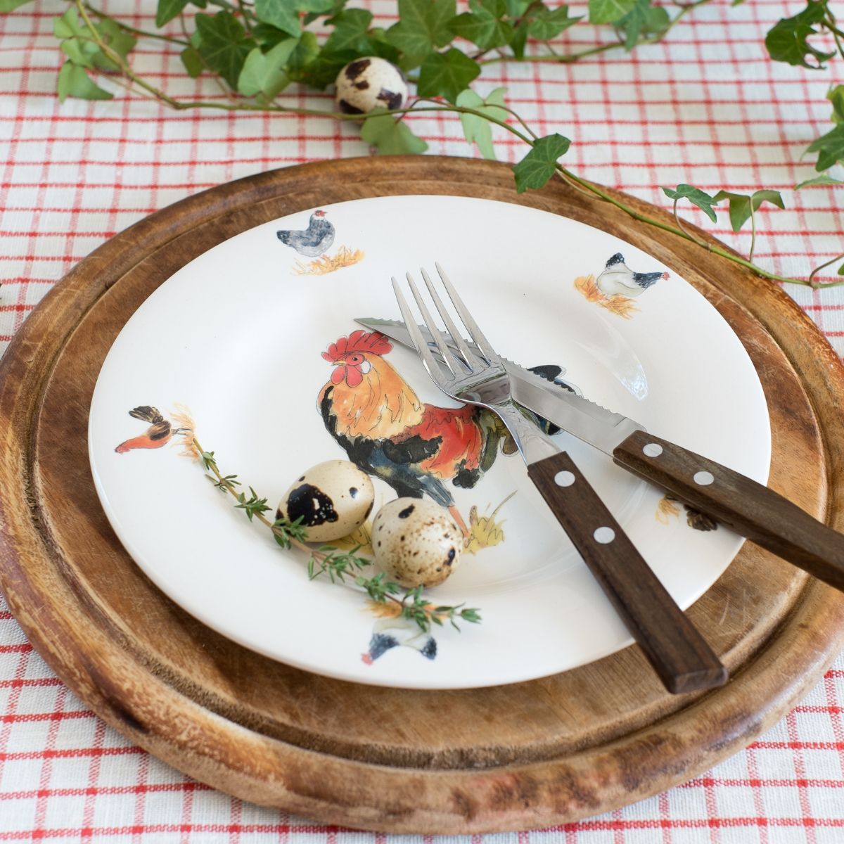 White plate with hens and rooster design.