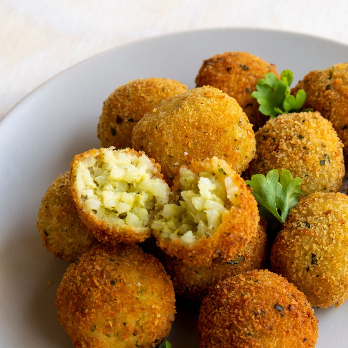 Risotto balls sprinkles with parsley.